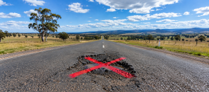Regional road with with pothole australia